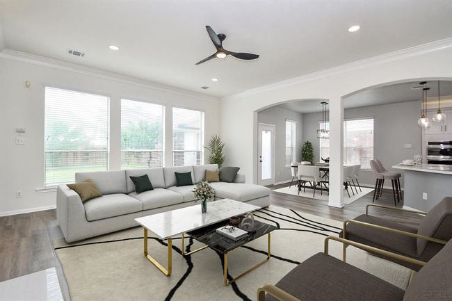 Welcome to your grand living room! Measuring 17' x 20', your living room is complete with architectural details of arches and a wall of windows that let in bright streams of light and gives your living room a bright and airy feel. Note that your home is freshly painted throughout (2025) - including ceiling walls and trims - with highquality Sherwin Williams paint. | Image 14