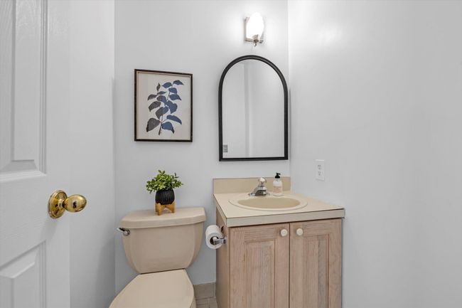Half bathroom featuring vanity and toilet | Image 10