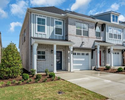 You have a garage and 2 car driveway out front for additional parking. | Image 2