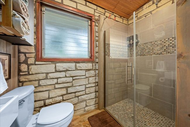 Bathroom featuring wood ceiling and a stall shower | Image 17
