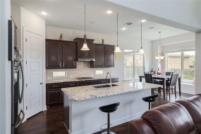 Upgraded granite, 2 window inserts plus a window bench to allow so much natural light in. | Image 2