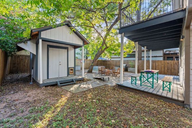 Fenced backyard with a storage shed and a wooden deck | Image 20