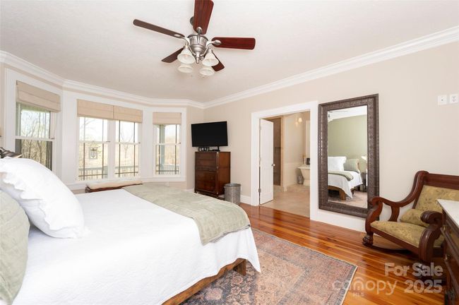 Main Level Primary Suite has French Doors to luxurious spa bathroom | Image 20