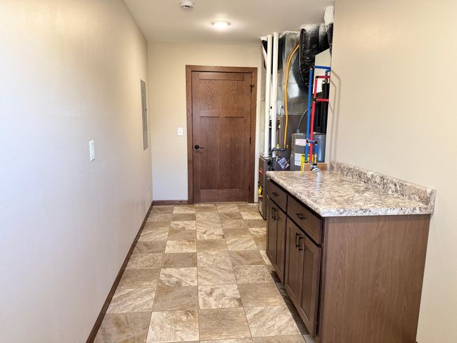 All utilities are located in the laundry room. | Image 19