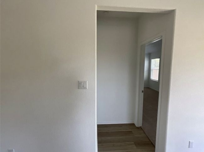 Corridor featuring wood finished floors and baseboards | Image 26