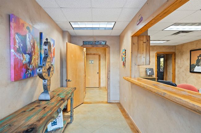 Hallway featuring a drop ceiling and tile patterned floors | Image 30
