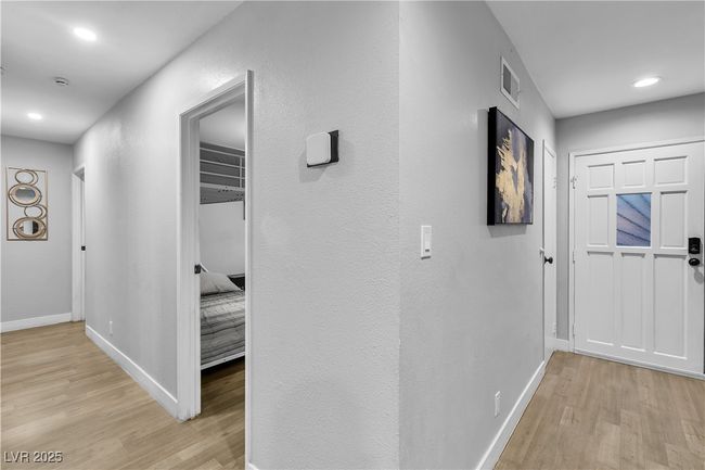Hallway with recessed lighting, visible vents, light wood-style flooring, and baseboards | Image 24