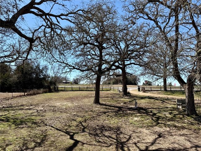 View of yard featuring a rural view and fence | Image 11