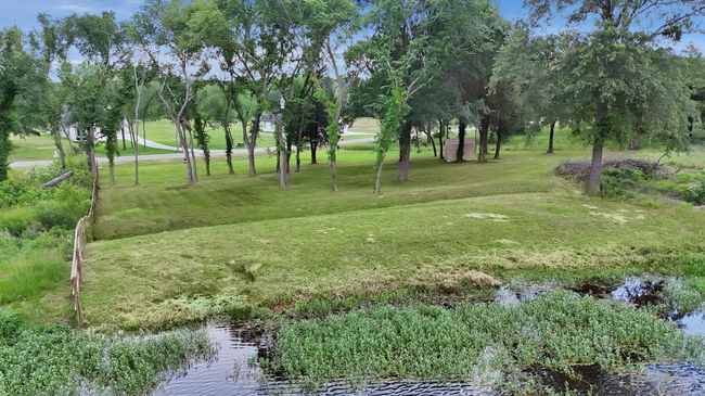 View of community with a water view and a lawn | Image 6