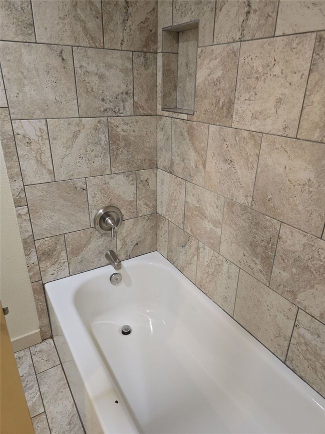 Bathroom featuring washtub / shower combination | Image 28