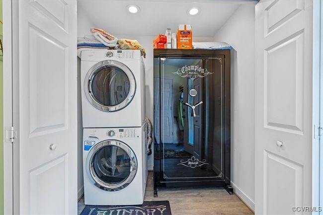 Laundry room with washer & dryer that convery - located off the kitchen. | Image 10