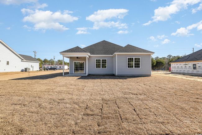 Rear view of property with ceiling fan | Image 30