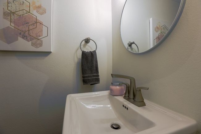 Powder Bathroom featuring a sink a lovely pedestal sink. | Image 6