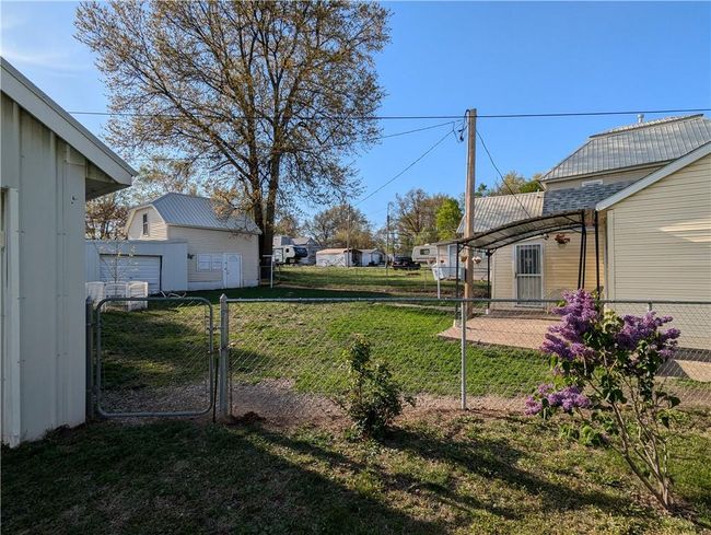 View of yard featuring a gate and fence | Image 6