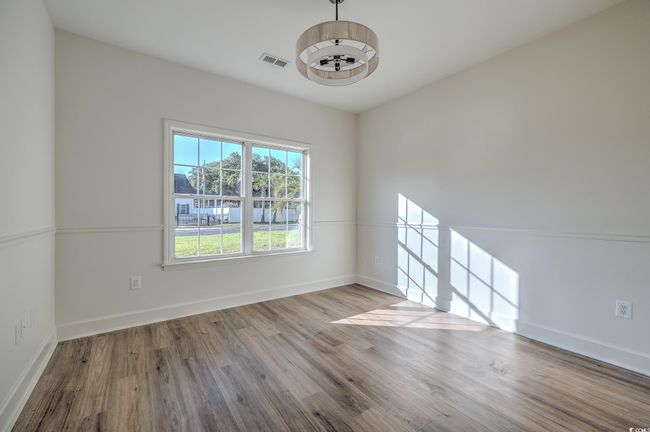 Empty room with wood finished floors and baseboards | Image 19