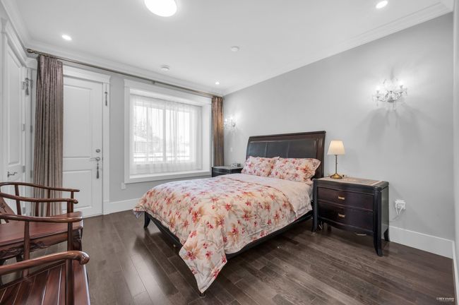 Bedroom featuring crown molding, dark wood-style flooring, and recessed lighting | Image 29