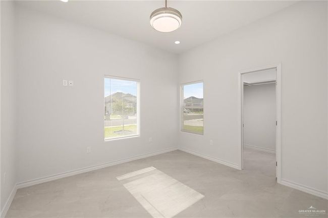 Spare room featuring baseboards | Image 13