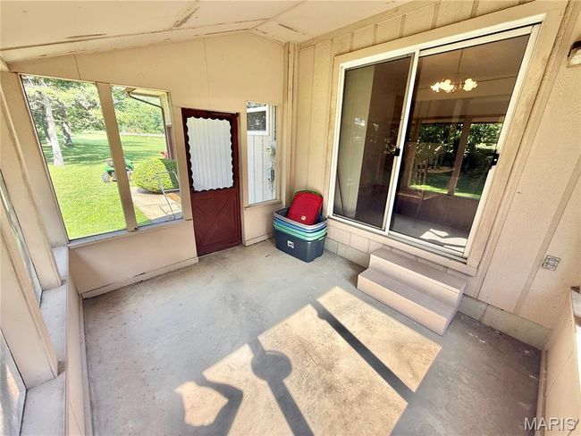 Doorway to property with a yard | Image 38