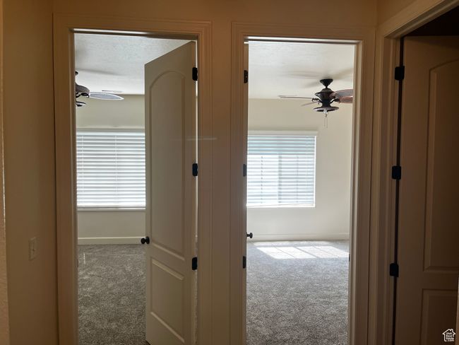 Hallway featuring carpet and baseboards | Image 12