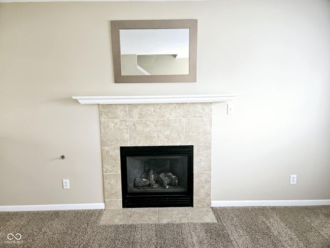 room details with baseboards, a tile fireplace, and carpet flooring | Image 13