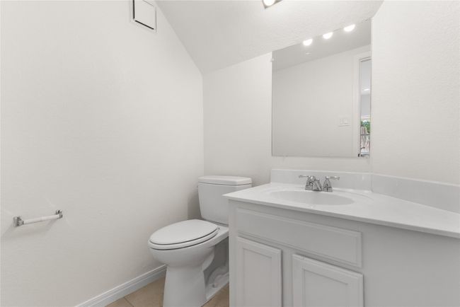 Bathroom featuring vanity, vaulted ceiling, and tile patterned flooring | Image 7