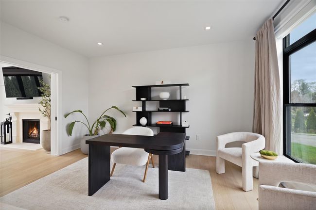 Office area with light wood finished floors, baseboards, recessed lighting | Image 15