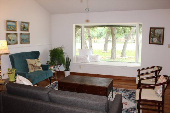 Living area featuring wood finished floors and lofted ceiling | Image 9