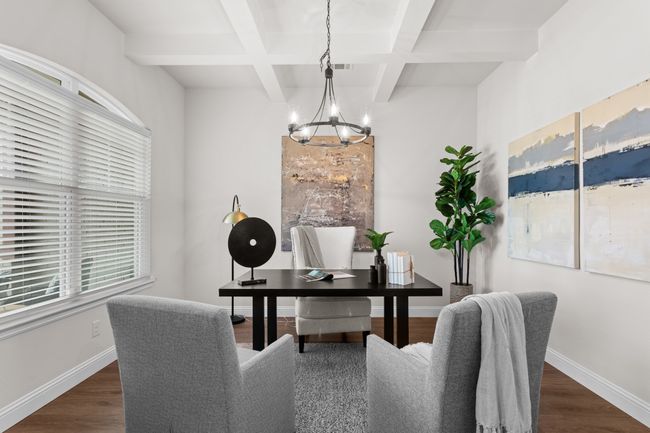 The study is spacious, with window coverings, lovely chandelier, and coffered ceiling | Image 7