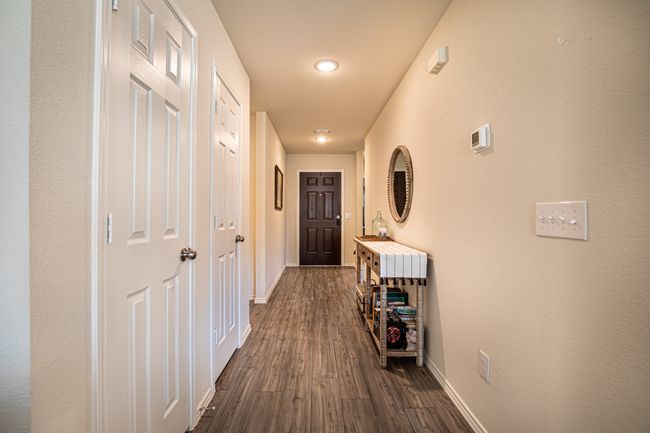 Hallway with dark wood-type flooring and recessed lighting | Image 20