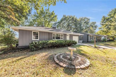 Single story home with a garage and a front yard | Image 2