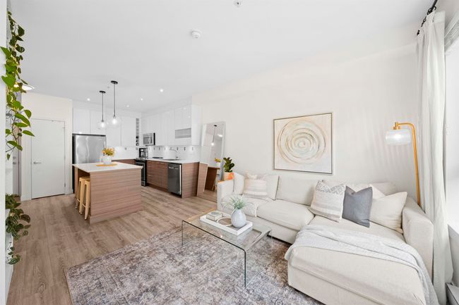 Living area featuring light wood-style flooring and recessed lighting | Image 5
