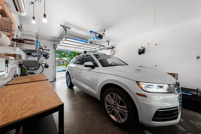 Wide one car garage, with room for a car and a workbench | Image 26