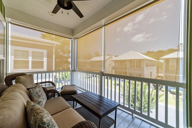 Sunroom / solarium featuring a ceiling fan | Image 30