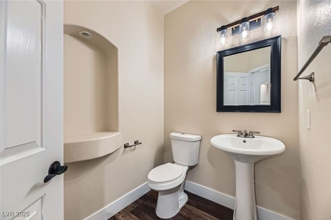 Bathroom with toilet and wood finished floors | Image 17