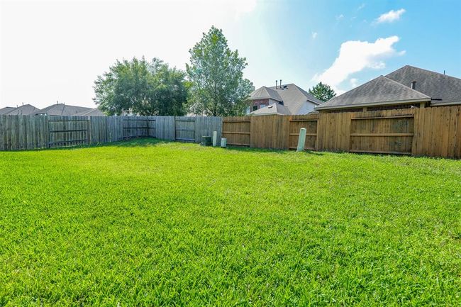Sturdy privacy fencing surrounds your private patch of the greater outdoors. | Image 32