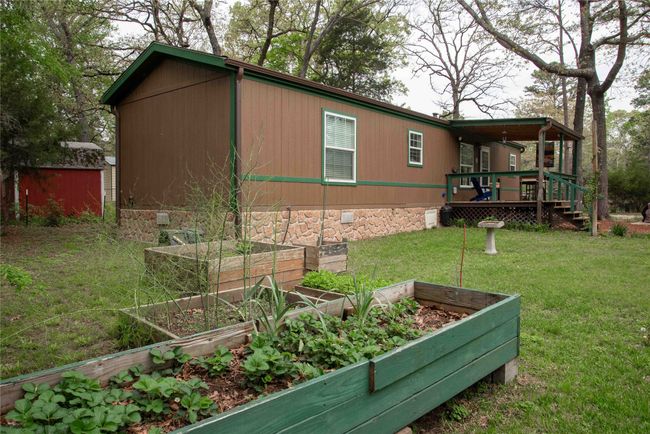 view from the gardens toward this well maintained 2/2 home | Image 7