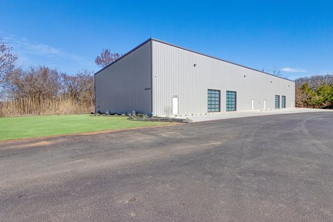 View of property with a garage and an outbuilding | Image 8