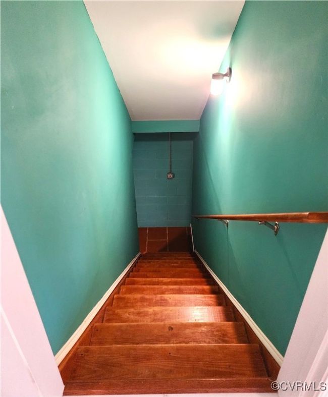 Stairs with wood finished floors and baseboards | Image 26