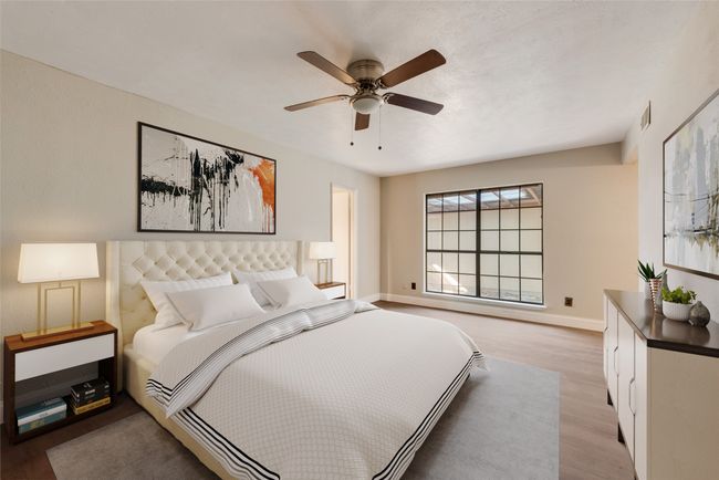 Bedroom featuring wood finished floors and a ceiling fan | Image 6