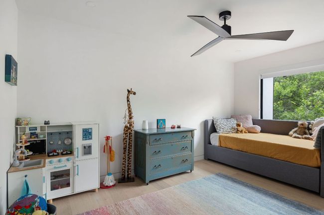Bedroom featuring wood finished floors and a ceiling fan | Image 22