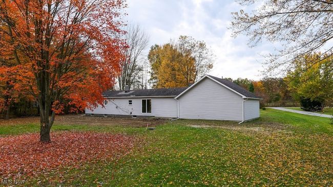 Back of property featuring a lawn | Image 13