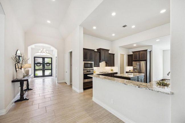 View of entry from hallway between dining room and kitchen | Image 5