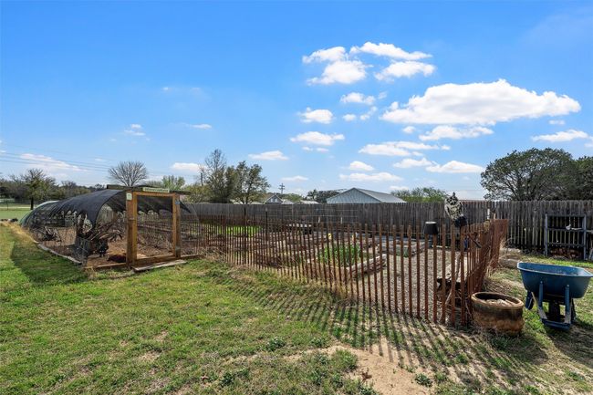 View of yard with a fenced backyard | Image 33