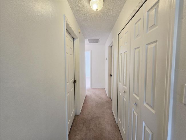 Hallway that takes you towards bedrooms 1 and 2 | Image 7