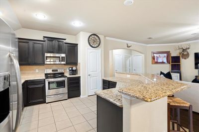 Spacious kitchen with huge island | Image 3