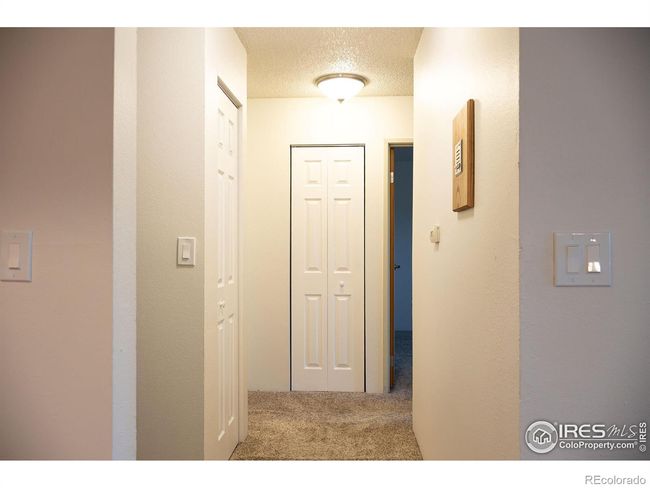Ample storage space with coat closet and linen closet with NEW doors | Image 17