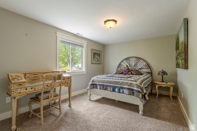 Bedroom with carpet floors and baseboards | Image 31