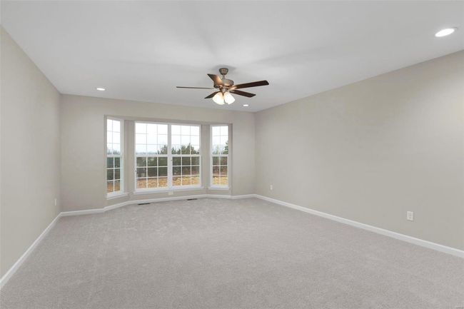 Carpeted empty room with ceiling fan | Image 8