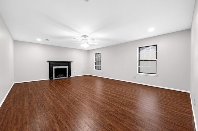 The primary bedroom has its own cozy fireplace as well as en-suite bath. | Image 30