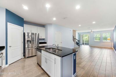 wood look tile throughout downstairs | Image 3